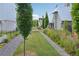 Charming townhomes featuring well-maintained green spaces, landscaping, and uniform architectural design, creating a serene living environment at 135 Channing Ln, Fayetteville, GA 30214