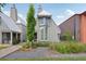 Charming home exterior with manicured landscaping, stone pathway, and modern gray facade at 135 Channing Ln, Fayetteville, GA 30214