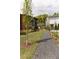 Scenic view of well-maintained lawns and gravel paths between modern homes at 135 Channing Ln, Fayetteville, GA 30214