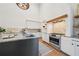 Modern kitchen boasts an island with stainless steel appliances and countertops, stylish backsplash and lighting at 135 Channing Ln, Fayetteville, GA 30214