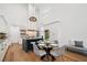 Gourmet kitchen featuring a center island, a dining area, and modern pendant lighting at 135 Channing Ln, Fayetteville, GA 30214