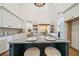 Modern kitchen island with granite countertop and stools at 135 Channing Ln, Fayetteville, GA 30214