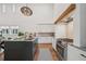 Modern kitchen featuring a large island, stainless steel appliances, custom cabinetry, and stylish lighting fixtures at 135 Channing Ln, Fayetteville, GA 30214