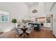 Eat-in kitchen boasts modern appliances, island with breakfast bar, and a large dining area at 135 Channing Ln, Fayetteville, GA 30214