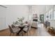 Bright, open-concept living space featuring a dining area and a cozy fireplace with high ceilings at 135 Channing Ln, Fayetteville, GA 30214