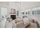 Bright open living room with hardwood floors, fireplace and soaring ceilings, perfect for entertaining at 135 Channing Ln, Fayetteville, GA 30214