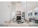Bright living room boasts a fireplace, soaring ceilings with decorative lighting, and a flood of natural light at 135 Channing Ln, Fayetteville, GA 30214