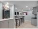 Finished basement with bar, stools, wine cooler, and recessed lighting at 220 Autumn Sage Dr, Alpharetta, GA 30005