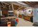 Unfinished basement space ideal for a workshop, complete with storage and workspace at 220 Autumn Sage Dr, Alpharetta, GA 30005