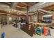 Large unfinished basement area with exposed ceiling and ample space for storage at 220 Autumn Sage Dr, Alpharetta, GA 30005