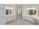 Bright bathroom featuring double sinks, tile floors, a glass shower, and plentiful storage at 220 Autumn Sage Dr, Alpharetta, GA 30005
