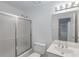 Clean bathroom featuring a shower-tub combination, vanity, and neutral decor at 220 Autumn Sage Dr, Alpharetta, GA 30005