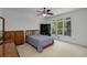 Bedroom featuring neutral carpet, furniture, and windows offering outdoor views at 220 Autumn Sage Dr, Alpharetta, GA 30005