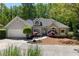 Charming single-Gathering home with a well-manicured front yard and an attached two-car garage at 220 Autumn Sage Dr, Alpharetta, GA 30005