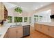 Updated kitchen with stainless steel appliances, granite countertops, and a scenic view at 220 Autumn Sage Dr, Alpharetta, GA 30005