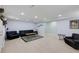 Spacious living room featuring recessed lighting, sleek floors, and stylish modern decor at 220 Autumn Sage Dr, Alpharetta, GA 30005