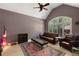 Cozy living room with vaulted ceilings, large windows, and comfortable seating at 220 Autumn Sage Dr, Alpharetta, GA 30005