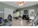 Comfortable home office space featuring natural light, desk space, and stylish furniture at 220 Autumn Sage Dr, Alpharetta, GA 30005