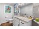 Bright bathroom with granite countertops and decorative stained-glass window at 3051 Deanna Way, Lawrenceville, GA 30044
