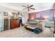 Bright bedroom features natural light, ceiling fan, and colorful furnishings at 3051 Deanna Way, Lawrenceville, GA 30044