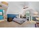 Spacious bedroom in bonus room features natural light and eclectic furnishings at 3051 Deanna Way, Lawrenceville, GA 30044