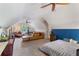 Spacious bonus room with a full-size bed and living area at 3051 Deanna Way, Lawrenceville, GA 30044