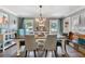 Dining room boasts hardwood floors, chandelier, and plenty of natural light at 3051 Deanna Way, Lawrenceville, GA 30044