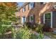 Lovely brick home featuring a bright blue door and landscaped front garden at 3051 Deanna Way, Lawrenceville, GA 30044