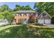Charming two-story brick home with well-manicured lawn and a two-car garage at 3051 Deanna Way, Lawrenceville, GA 30044