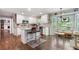 Bright eat-in kitchen with white cabinets, granite counters, stainless appliances and island at 3051 Deanna Way, Lawrenceville, GA 30044