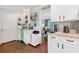 Well-lit kitchen with white cabinetry, granite countertops, and stainless appliances at 3051 Deanna Way, Lawrenceville, GA 30044