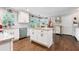 Updated kitchen with white cabinets, stainless steel appliances, and a central island at 3051 Deanna Way, Lawrenceville, GA 30044