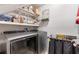 Laundry room with new washer and dryer and shelving at 3051 Deanna Way, Lawrenceville, GA 30044