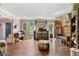 Bright living room with hardwood floors and large windows overlooking the yard at 3051 Deanna Way, Lawrenceville, GA 30044