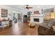 Open living room featuring hardwood floors, a fireplace, and ample seating at 3051 Deanna Way, Lawrenceville, GA 30044