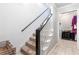 Carpeted stairway with white risers, leading to the upper level at 3051 Deanna Way, Lawrenceville, GA 30044