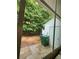 View of backyard with mature trees, storage shed, and lawn. Great for outdoor activities at 3336 Waldrop Trl, Decatur, GA 30034