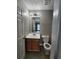 Compact bathroom featuring a vanity with cabinets, a toilet, and neutral paint at 3336 Waldrop Trl, Decatur, GA 30034