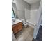Bathroom featuring a tub with shower, tile flooring, and a vanity with storage at 3336 Waldrop Trl, Decatur, GA 30034