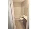 Full bathroom with tiled shower, toilet, and vanity with a light wood cabinet at 3336 Waldrop Trl, Decatur, GA 30034