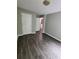 Bedroom with hardwood floors, neutral paint, two white doors and adequate natural light at 3336 Waldrop Trl, Decatur, GA 30034