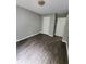 Bedroom with hardwood floors, neutral paint, two white doors and adequate natural light at 3336 Waldrop Trl, Decatur, GA 30034