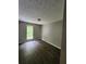 Bedroom with hardwood floors, neutral paint, one window and adequate natural light at 3336 Waldrop Trl, Decatur, GA 30034