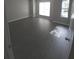 Large bedroom with dark wood flooring and plenty of light from multiple windows at 3336 Waldrop Trl, Decatur, GA 30034