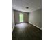 Bedroom with hardwood floors, neutral paint, one window and adequate natural light at 3336 Waldrop Trl, Decatur, GA 30034