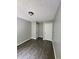 Bedroom with hardwood floors, neutral paint, two white doors and adequate natural light at 3336 Waldrop Trl, Decatur, GA 30034