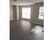 Spacious bedroom with large windows for natural light and sleek hardwood floors at 3336 Waldrop Trl, Decatur, GA 30034