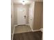 Open entryway featuring neutral-colored walls, tiled flooring, and doors leading to other rooms in the home at 3336 Waldrop Trl, Decatur, GA 30034