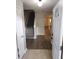 Inviting entryway with tiled floor transitioning to wood flooring and a staircase leading to the upper level at 3336 Waldrop Trl, Decatur, GA 30034