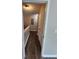 Bright hallway with hardwood floors and access to multiple rooms, featuring neutral paint tones and a textured ceiling at 3336 Waldrop Trl, Decatur, GA 30034